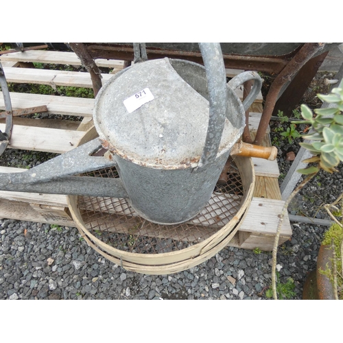 571 - Galvanised watering can and sieve.