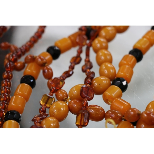 225 - Strand of faux butterscotch amber beads, an amber pendant on necklace, raw amber, earrings, etc.