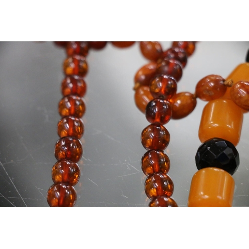 225 - Strand of faux butterscotch amber beads, an amber pendant on necklace, raw amber, earrings, etc.