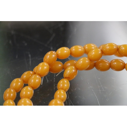 231 - Triple strand of graduated butterscotch amber bead necklace, 24cm, 108g gross.