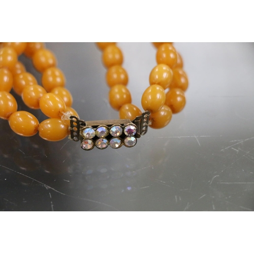 231 - Triple strand of graduated butterscotch amber bead necklace, 24cm, 108g gross.