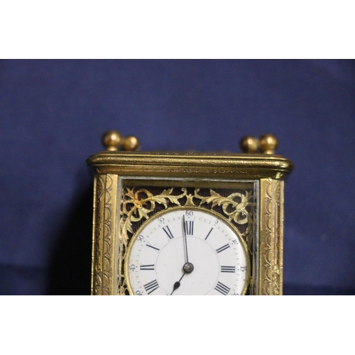 388 - C. 1900 miniature four glass carriage clock with classical decoration and enamel dial with Roman and... 