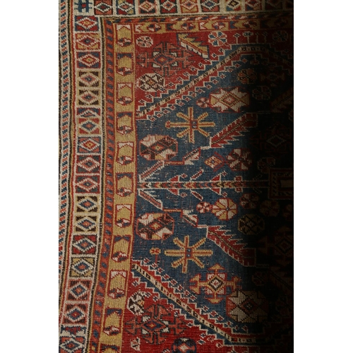 561 - North west Persian rug with stylized flowerheads to field and multiple borders, 167 x 113.