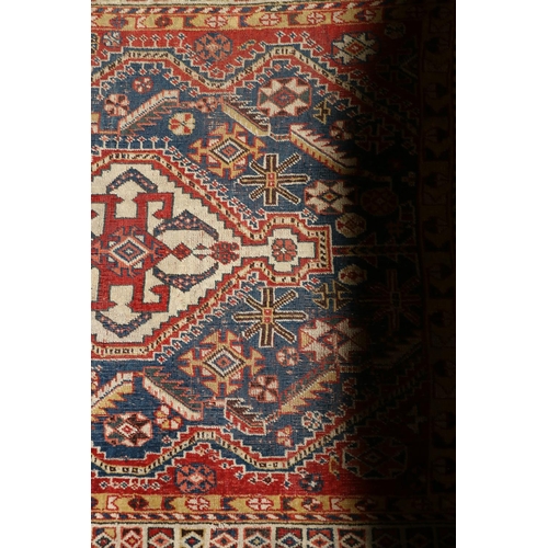 561 - North west Persian rug with stylized flowerheads to field and multiple borders, 167 x 113.