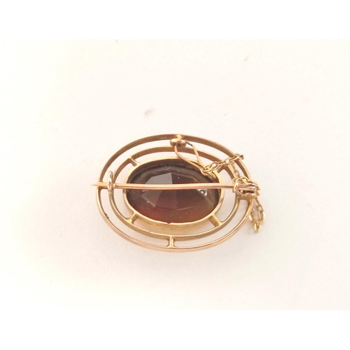 3 - Citrine oval brooch in gold, probably 9ct. C1920