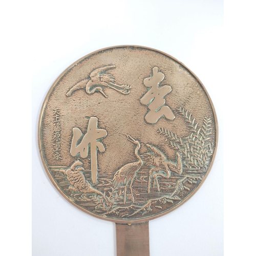 341 - Japanese bronze hand mirror decorated with cranes and calligraphic character marks, 20cm diameter wi... 