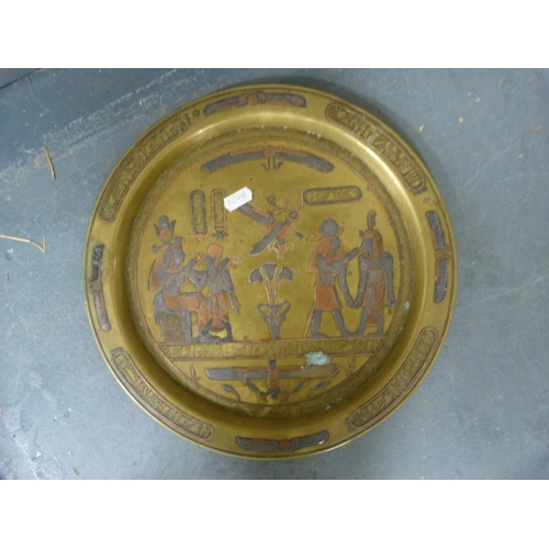 104 - Two circular wall mirrors and a pair of brass Egyptian wall plaques.