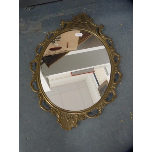 104 - Two circular wall mirrors and a pair of brass Egyptian wall plaques.