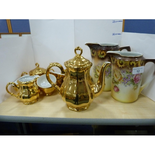 12 - Pair of graduated floral decorated jugs and a Bavarian gilt coffee service.