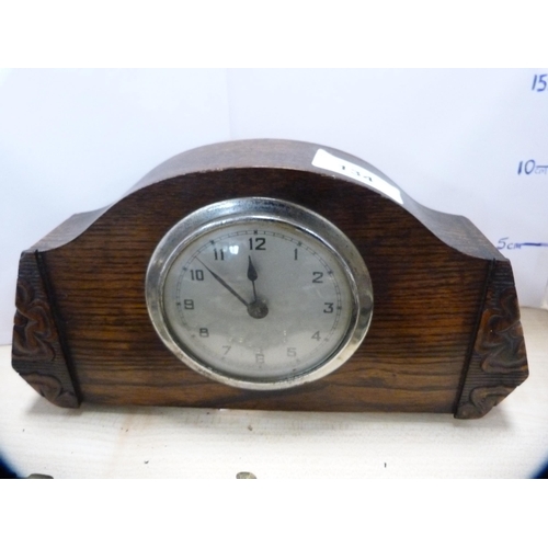 134 - Oak cased mantel clock and a collection of various horse brasses.