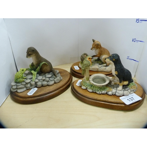 137 - Three Border Fine Arts figures to include a puppy and robin, fox and hedgehog, otter and frog. ... 