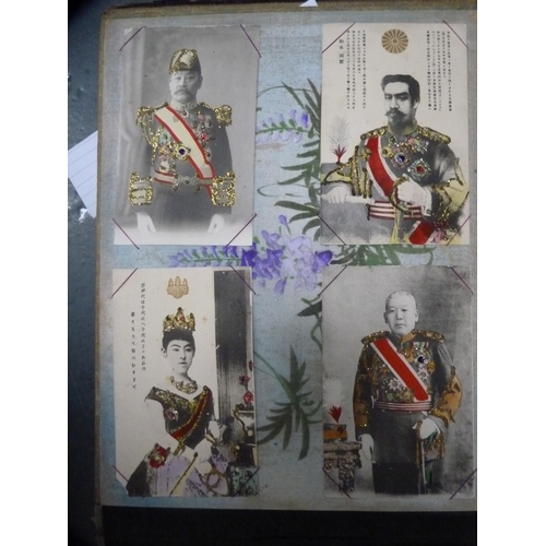 143 - Japanese lacquered postcard album containing postcards to include royalty, farming and landscape sce... 