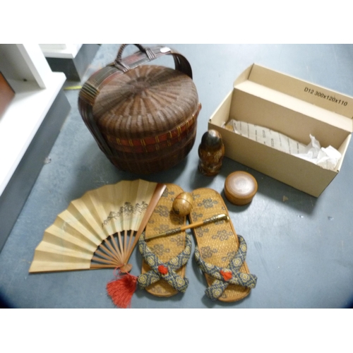 144 - Carton containing collectables to include a pair of Japanese woven slippers, sandalwood fan, Russian... 