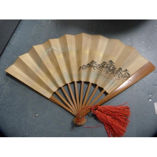 144 - Carton containing collectables to include a pair of Japanese woven slippers, sandalwood fan, Russian... 