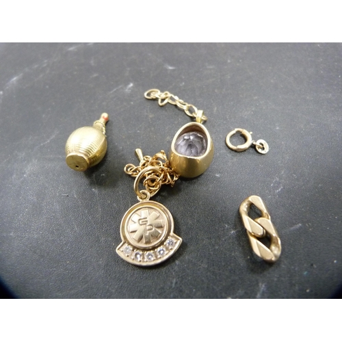 149 - 10ct gold and diamond pendant set with five small brilliants, 4.3g gross, attached to a yellow metal... 