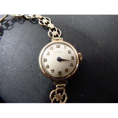 149A - Lady's Griffon wristwatch, possibly 9ct gold backed, on flexible rolled gold bracelet strap.