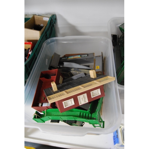 249 - Four cartons containing OO gauge model railway track scenery and fittings to include gates, Tri-ang ... 