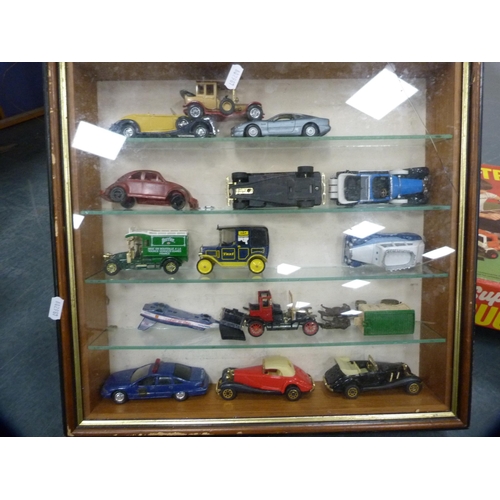 30 - Collection of boxed games, model vehicles in display cabinet and other vehicles, model aircraft etc.