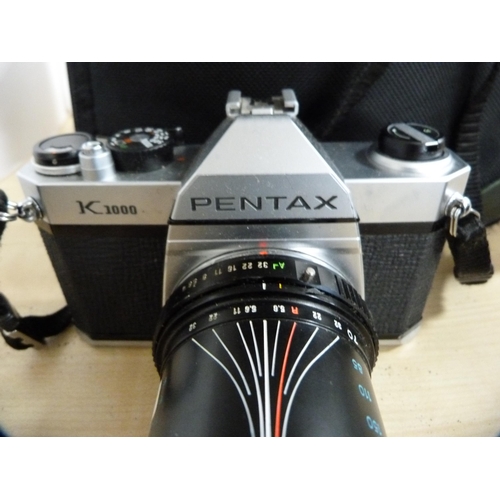 313 - Pentax K1000 camera with Tokina 70-210mm lens, Asahi Pentax ME camera with 35-70mm lens, and a Prakt... 