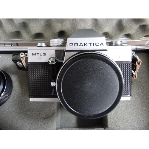 315 - Two Praktica MTL3 cameras, one example in a fitted box with a Carl Zeiss lens, instruction booklet a... 