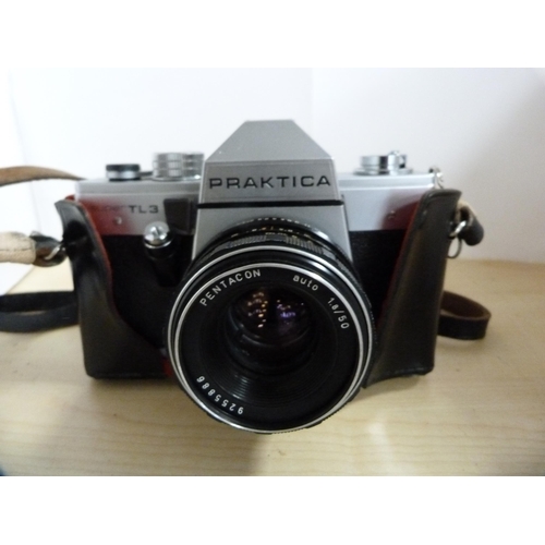 315 - Two Praktica MTL3 cameras, one example in a fitted box with a Carl Zeiss lens, instruction booklet a... 