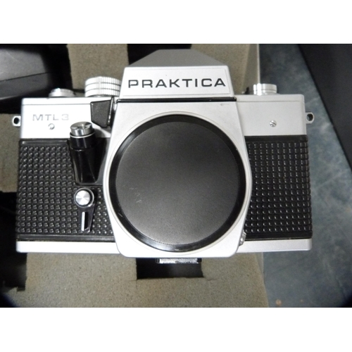 334 - Praktica MTL3 camera with lenses and accessories, in fitted camera box.