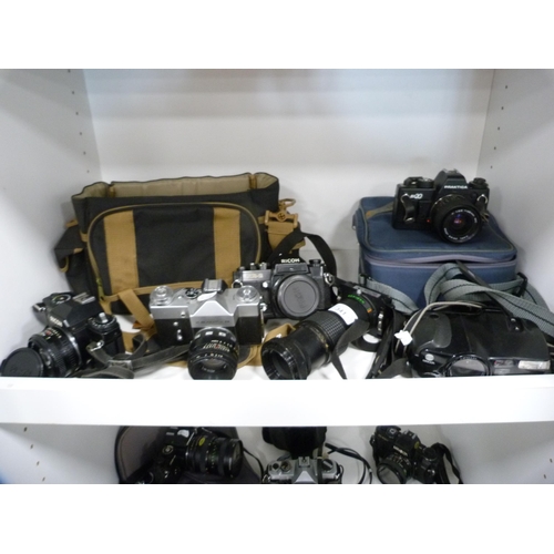 341 - Group of cameras to include a Ricoh KR-10 and XR-2, Zenit B, Praktica BX20 with accessories, Makinon... 