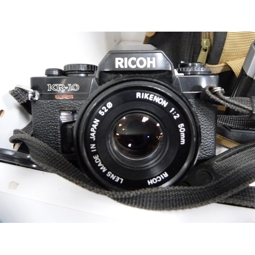 341 - Group of cameras to include a Ricoh KR-10 and XR-2, Zenit B, Praktica BX20 with accessories, Makinon... 