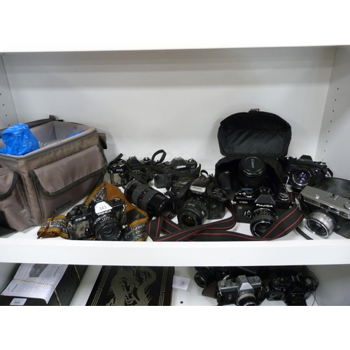 343 - Group of cameras to include a Yashica FX-3 and FX-D, Minolta, Cosina, Fujica, Canon Eos Rebel, Konic... 