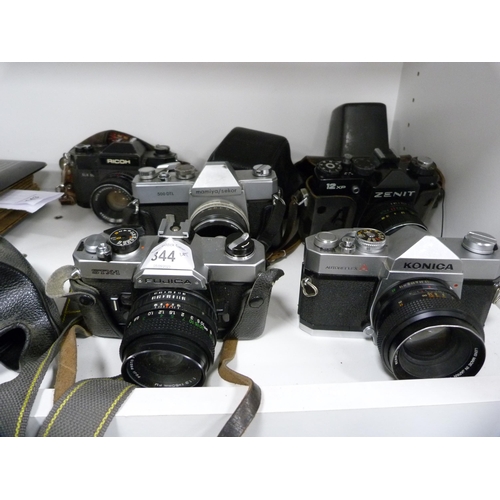 344 - Group of cameras to include a Zenit 12xP, Konica, Fujica, Mamiya/Sekor and Ricoh.