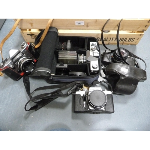 347 - Carton containing cameras to include a Praktica MTL3 with Carl Zeiss Tessar lens, Praktica B100, Pra... 