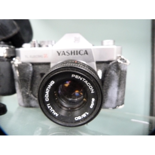 355 - Yashica FX-D Quartz camera with Yashica 50mm lens and a Yachica TL Electro X camera with Pentacon le... 