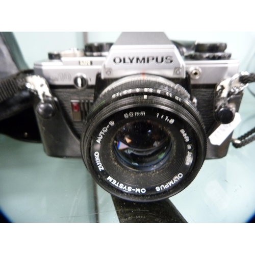 360 - Three Olympus OM10 cameras, one example with a Tokina 70mm lens.  (3)