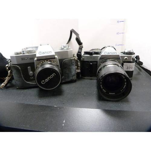 370 - Two Canon cameras to include an AE-1 with Canon 35-70mm lens, and an EXEE.  (2)