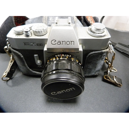 370 - Two Canon cameras to include an AE-1 with Canon 35-70mm lens, and an EXEE.  (2)