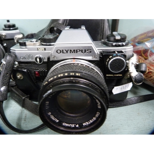 371 - Four Olympus OM10 cameras and an Olympus OM1 camera.  (5)