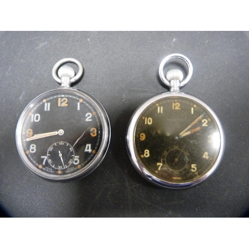 387 - Two military issue pocket watches, both with black dials, one stamped G.S.T.P, no. 259468.  (2)