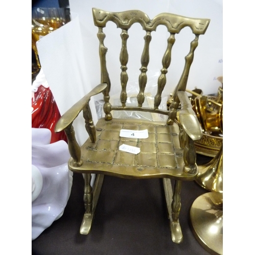 4 - Collection of brassware to include a brass rocking chair, two pairs of brass candlesticks, candle sn... 