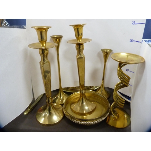 4 - Collection of brassware to include a brass rocking chair, two pairs of brass candlesticks, candle sn... 