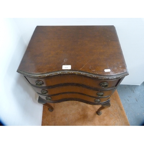 404 - Mahogany serpentine Queen Anne-style bedside chest of drawers.