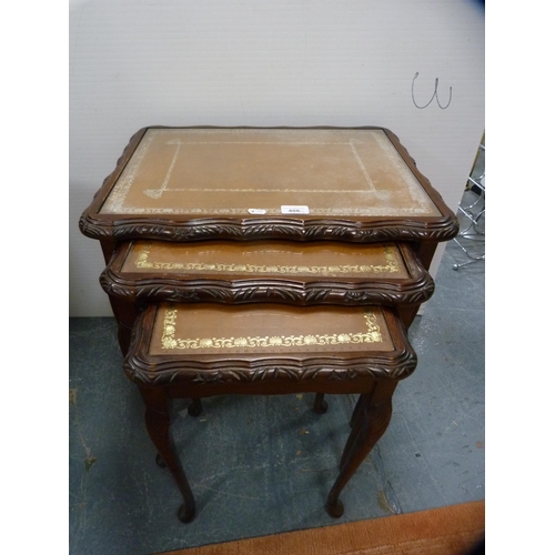 406 - Nest of three tooled-top tables and a drum occasional table.  (2)