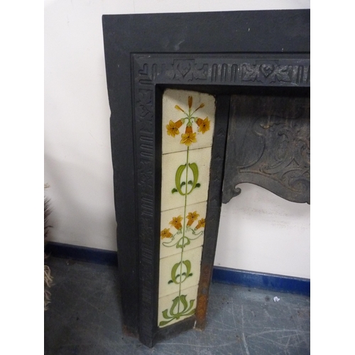 421 - Antique cast iron fire surround with tiled inserts.