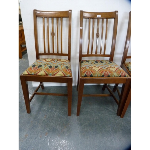 425 - Set of four mahogany rail-back dining chairs with Art Nouveau-style upholstery.  (4)