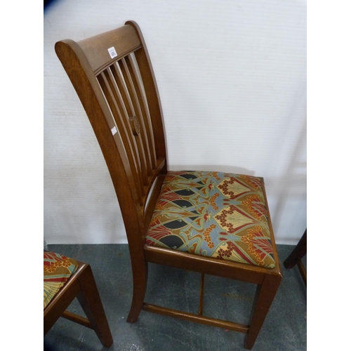 425 - Set of four mahogany rail-back dining chairs with Art Nouveau-style upholstery.  (4)