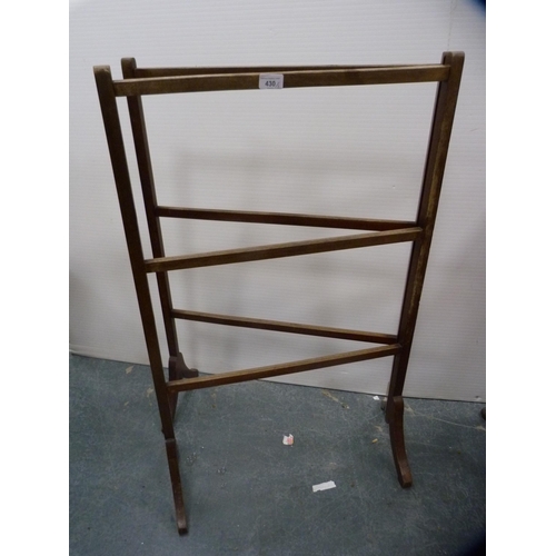 430 - Mahogany folding towel rail and a fire kerb.  (2)