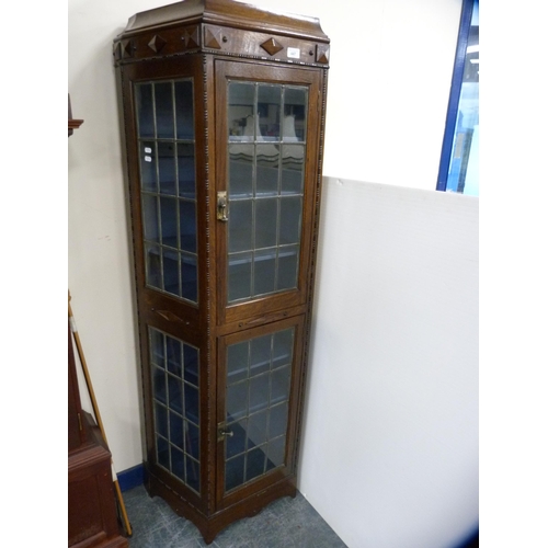 447 - Unusually shaped oak double-door display cabinet with leaded glass doors and panels.