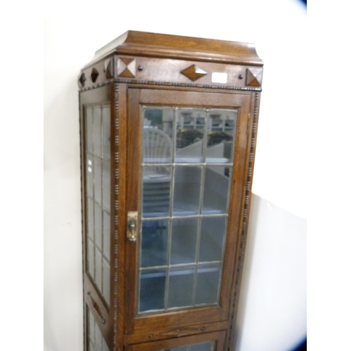 447 - Unusually shaped oak double-door display cabinet with leaded glass doors and panels.