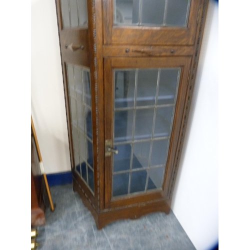 447 - Unusually shaped oak double-door display cabinet with leaded glass doors and panels.