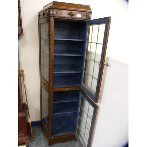 447 - Unusually shaped oak double-door display cabinet with leaded glass doors and panels.