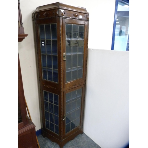 447 - Unusually shaped oak double-door display cabinet with leaded glass doors and panels.